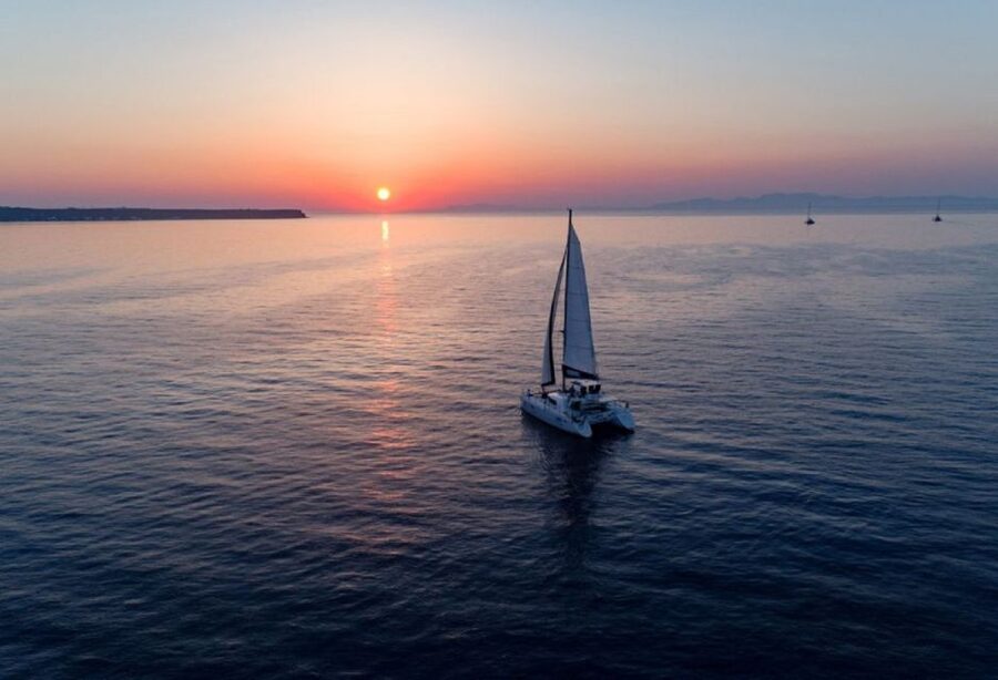 Santorini: Luxury Sunset Cruise with Dinner & Open Bar - Lighthouse area dinner: food served in a sea-view rhythm