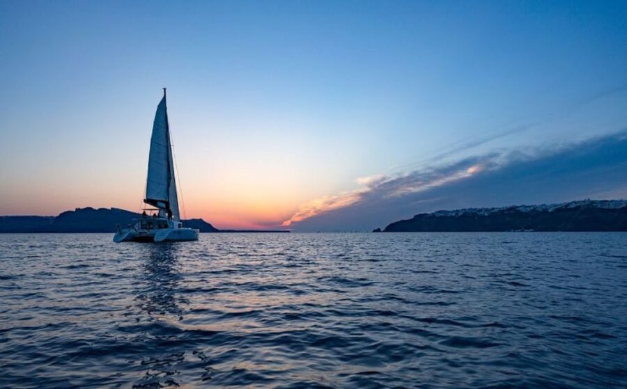 Santorini: Luxury Sunset Cruise with Dinner & Open Bar - Thirassia and the cliffside sail: your warm-up segment