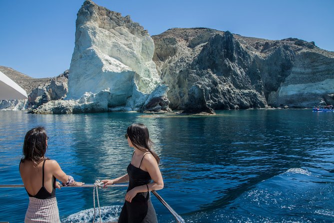 Santorini: Motor Yacht Day Cruise with 5-Course Lunch - Cruising out of Vlihada: the scenery comes before the swims