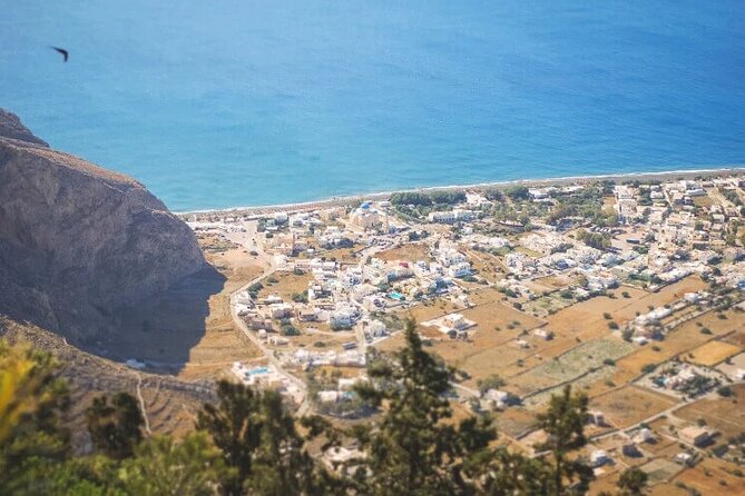 Santorini: Must-See & Winery Visit Private Tour - Red Beach volcanic cliffs: the signature color break