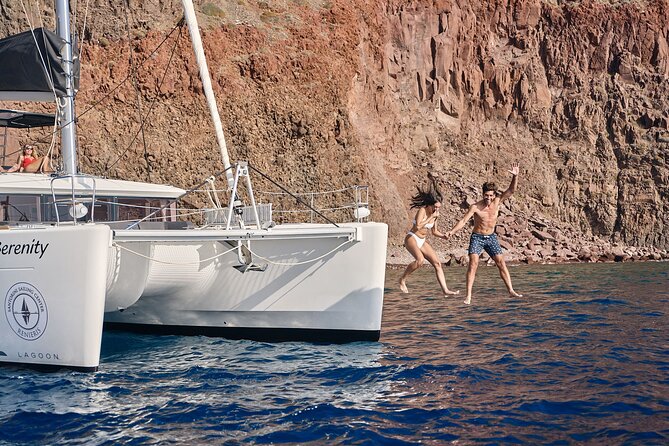 Santorini Oia: Luxury Sunset Cruise with Fresh Fish BBQ & Drinks - Red Beach and Mesa Pigadia: two ways to swim in volcanic color