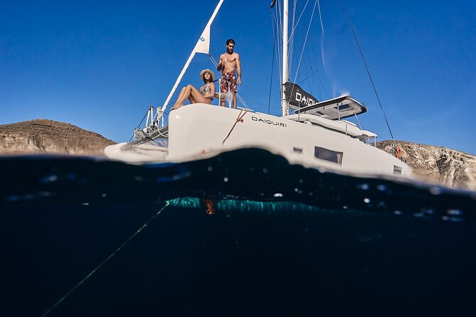 Santorini Oia: Luxury Sunset Cruise with Fresh Fish BBQ & Drinks - Comfort and safety: a catamaran setup that works for many skill levels