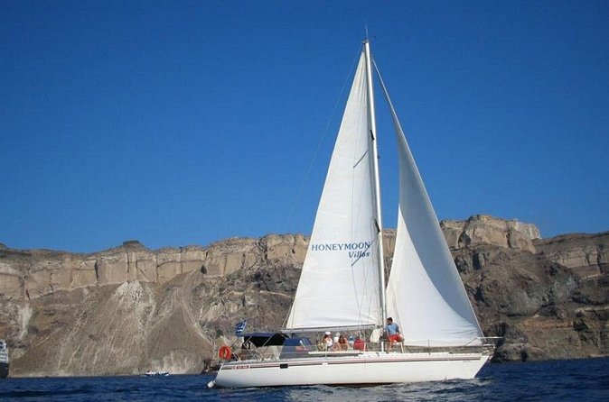 Santorini Oia: Private Sailing Yacht Cruise with Meal and Drinks - Volcano area and sulfur springs: black-rock scenery with real sea-level perspective