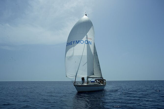 Santorini Oia: Private Sailing Yacht Cruise with Meal and Drinks - Thirassia swim stop: calm-bay water and short, sweet snorkeling time