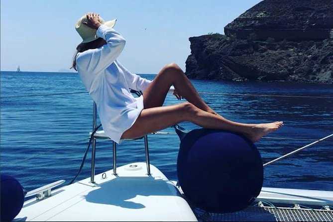 Santorini Platinum Catamaran Cruise with Meal, BBQ and Open Bar - Red Beach stop: color cliffs and a fast hit of drama