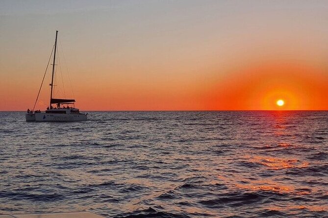Santorini Private Catamaran Cruise with BBQ, Open Bar & Transfers - White Beach: boat-only sand and the best excuse to snorkel