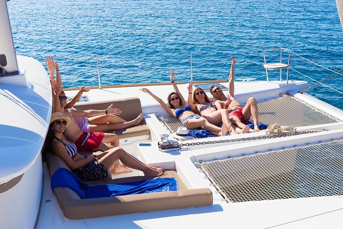 Santorini Private Catamaran Cruise with BBQ, Open Bar & Transfers - Passing the Indian Rocks: sea-level views of Aegean geology