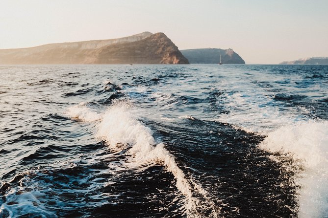 Santorini Private Catamaran Cruise with BBQ, Open Bar & Transfers - Palea Kameni hot springs: volcanic heat in sulfur-rich waters
