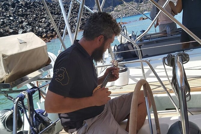 Santorini Semi-private Morning or Sunset Volcano Sailing Tour - Vlychada Beach: white volcanic cliffs on your first pass