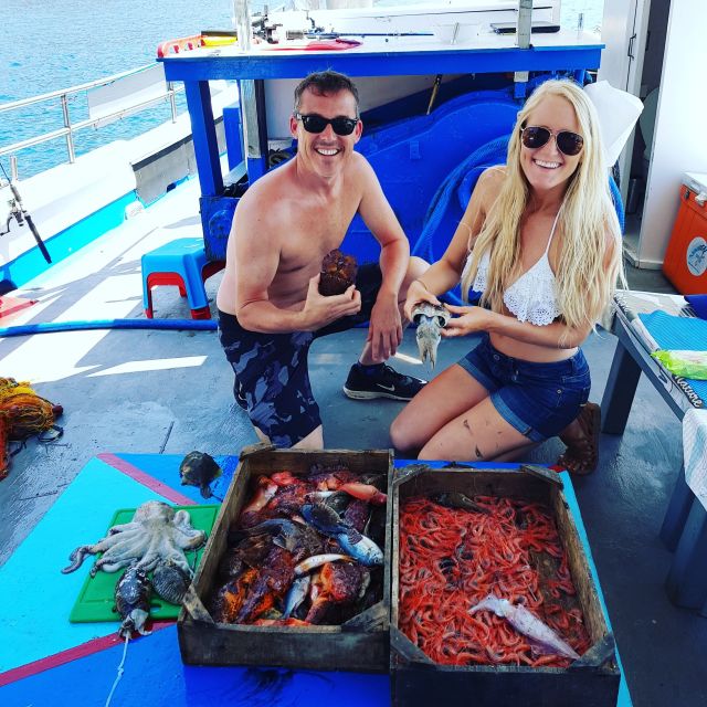 Santorini Sunset Fishing Trip with Dinner and Drinks - Music, cooking, and dinner on board: the meal part you’ll remember