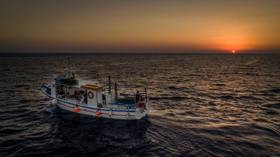 Santorini Sunset Fishing Trip with Dinner and Drinks - Pulling the line: what fishing feels like on this boat