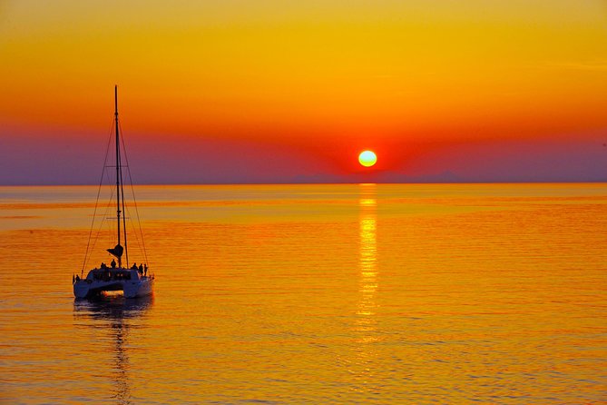 Santorini Sunset Luxury Sailing Catamaran Cruise with BBQ, drinks, transfer - Red Beach: a 30-minute swim with photo-worthy color