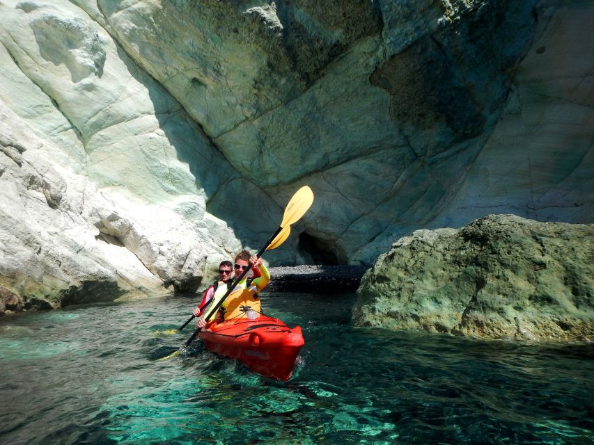 Santorini: Sunset Sea Kayak with Light Dinner - Returning west: sea cave views and Black Mountain sunset timing