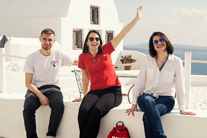 Santorini Sunset Walking Tour inc. tastings and 5 drinks - Fira lanes in the evening: souvlaki, Greek wine, and quieter views