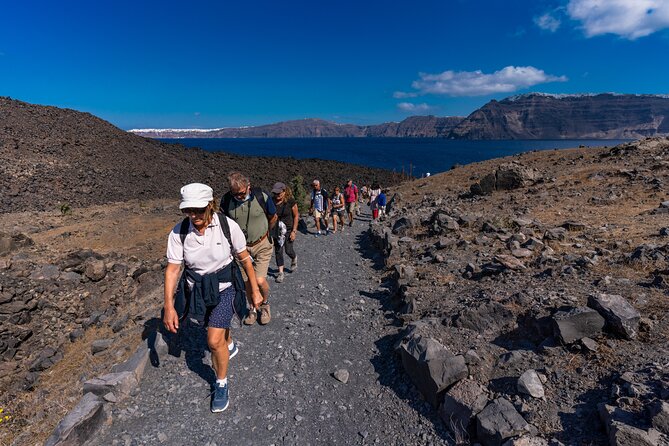 Santorini Tour of Caldera with Glass bottom Boat - Stop 1: Santorini Volcano and the Crater Walk Up