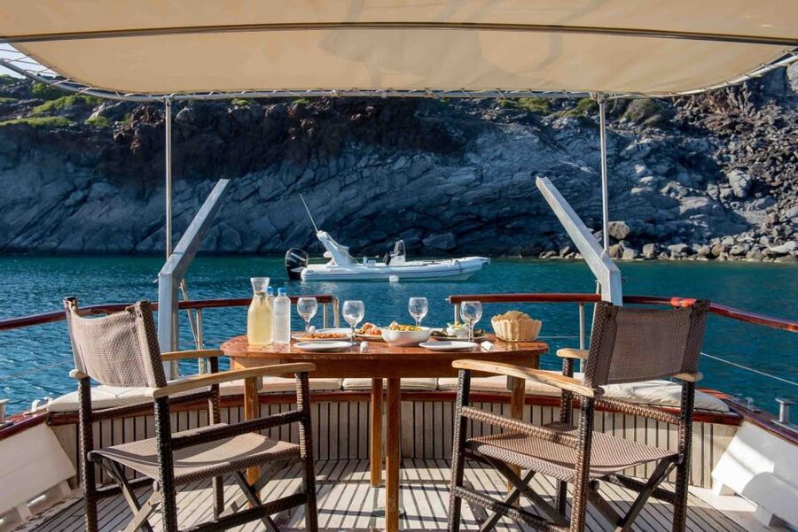 Santorini: Traditional Wooden Boat Tour with Meal and Wine - Black Mountain snorkeling: when the water actually earns its reputation