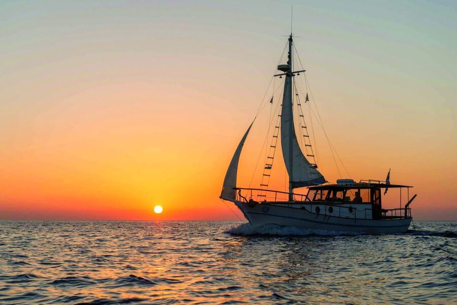 Santorini: Traditional Wooden Boat Tour with Meal and Wine - Sunset option: reverse route and a meal in hidden coves