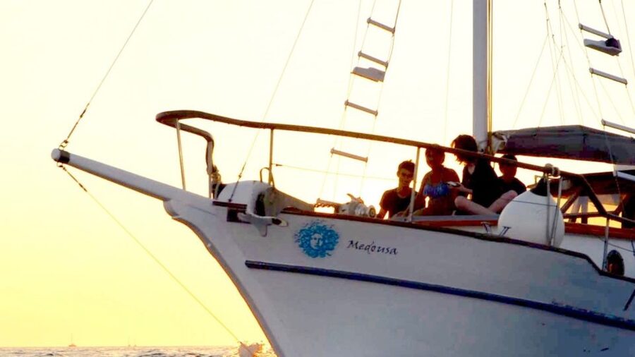 Santorini: Traditional Wooden Boat Tour with Meal and Wine - Getting to the port: pickup in a comfortable van