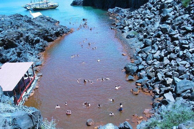 Santorini Volcanic Islands Cruise: Volcano,Hot Springs,Thirassia and Oia Sunset - Palea Kameni hot springs swim: sulfur water, slimy mud, and stains