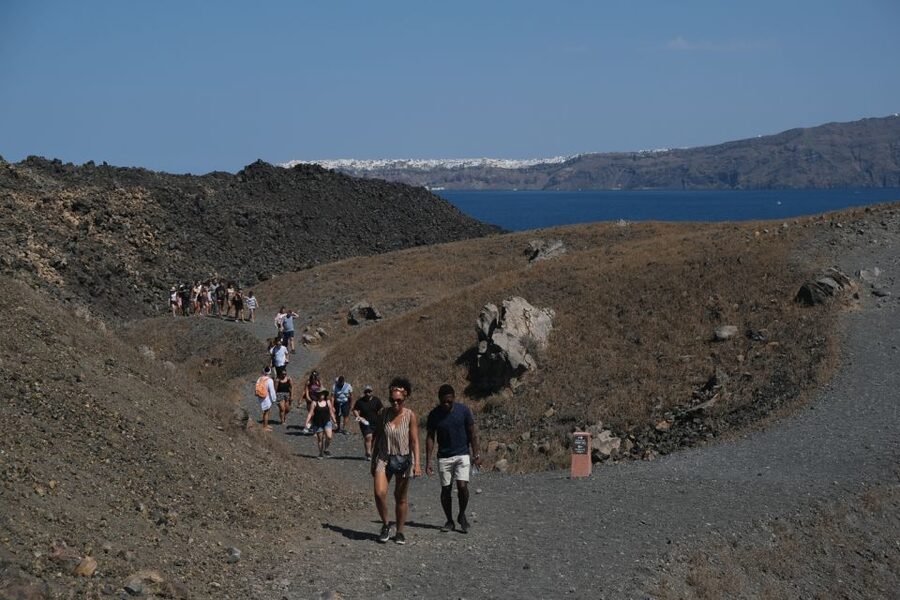 Santorini: Volcano and Hot Springs Sunset Dinner Cruise - Nea Kameni volcano: the climb, the views, and the one rule to respect