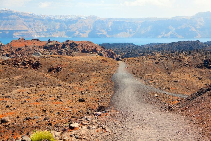 Santorini: Volcano and Hot Springs Sunset Dinner Cruise - Sailing to Thirasia: a calmer stop with real sea-level perspective
