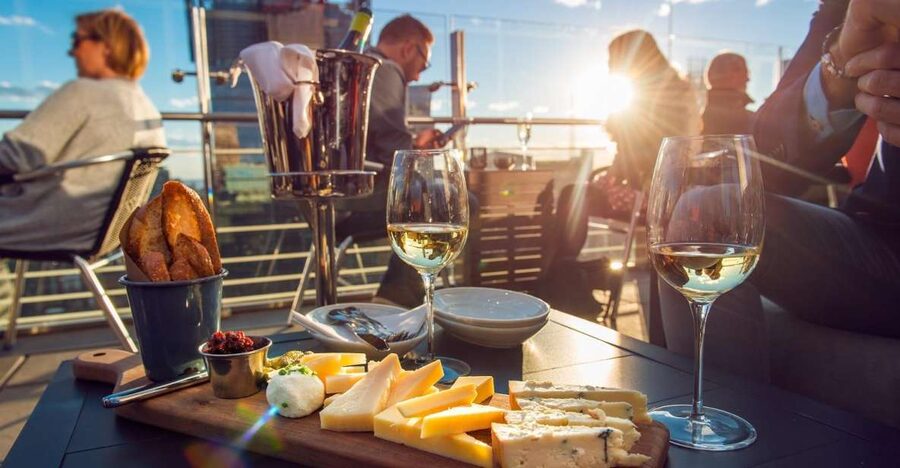 Santorini: Volcano and Hot Springs Sunset Dinner Cruise - From your hotel to Athinios Port: expect a pickup rhythm, not a sprint