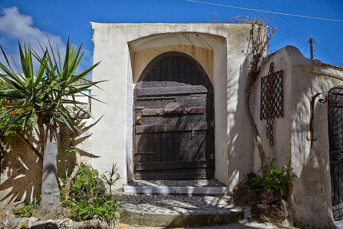 Santorini wine tasting and Traditional Cave Settlement Tour - Snacks, water, and the “don’t waste the day” pace