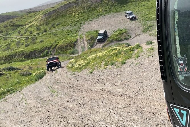 Santorini Wrangler Jeep Afternoon Convoy Tour - Pyrgos panoramas and Emporio windmills: quick stops with real payoff