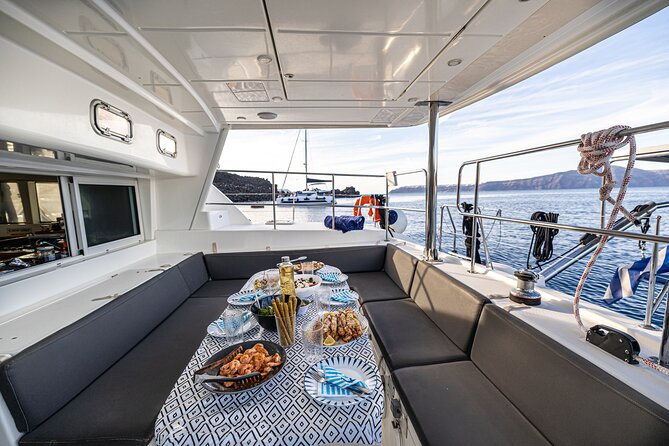 Semi Private Santorini Catamaran Tour - Stop 1: White Beach in one hour of sea-level views