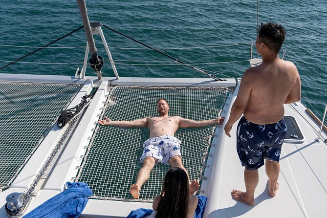 Semi Private Santorini Catamaran Tour - The crew experience: Dimitris, Renato, and Felipe set the tone