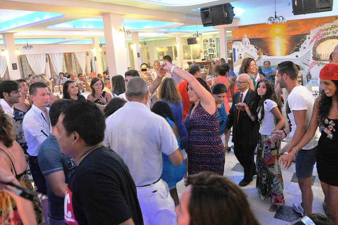 Traditional Greek Night live Music & Dinner Show in Santorini - Timing that actually helps: doors, buffet, bar, and show start
